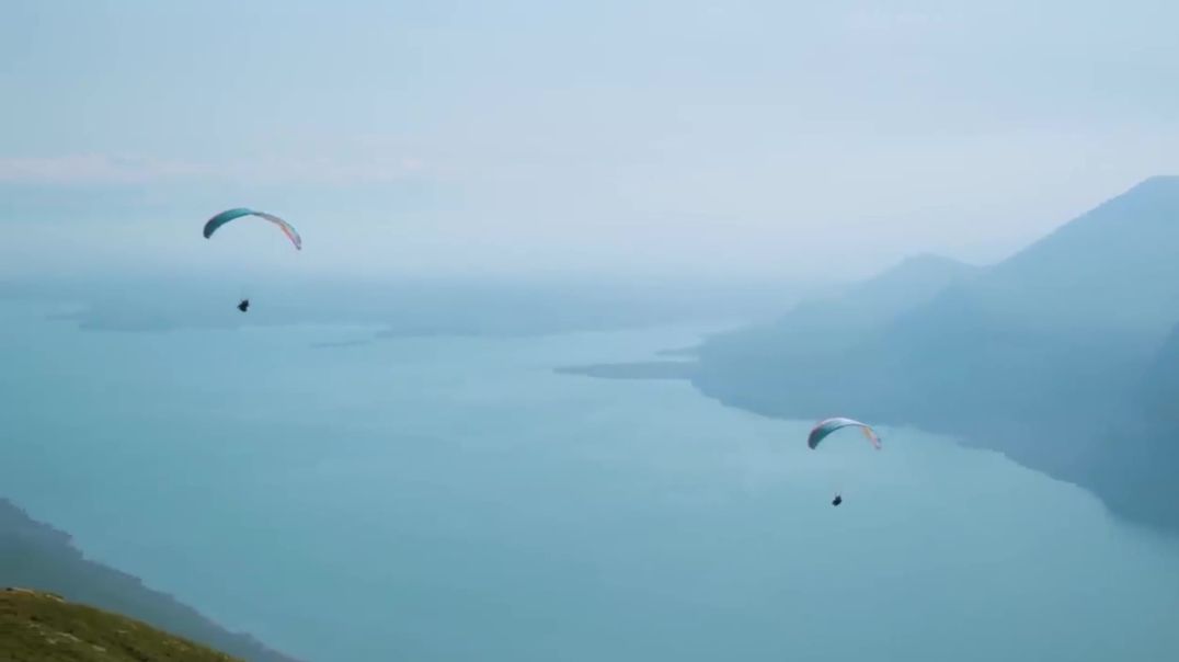 Free Paragliding Stock Footage over Scenic Lake and Mountains - Cinematic B-Roll for Commercial Use