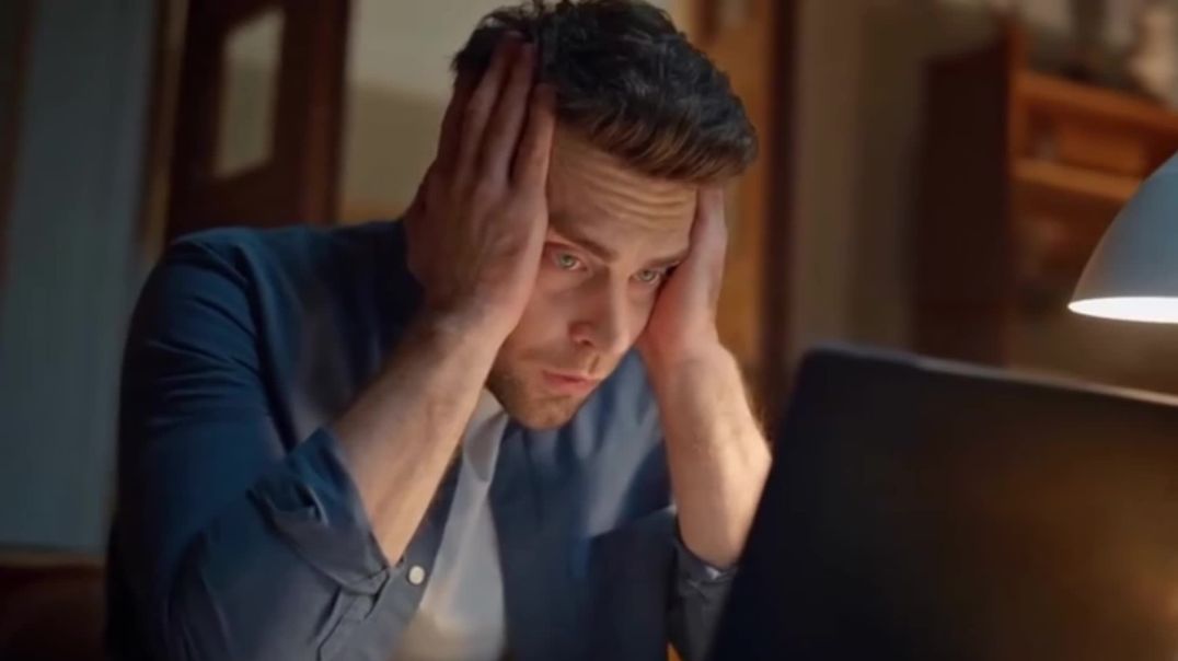 ⁣Stressed Man Working Late on Laptop Free Stock Footage