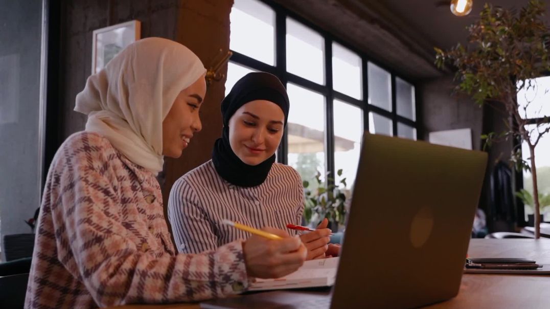 ⁣Muslim Women Studying in Cafe Free Stock Footage
