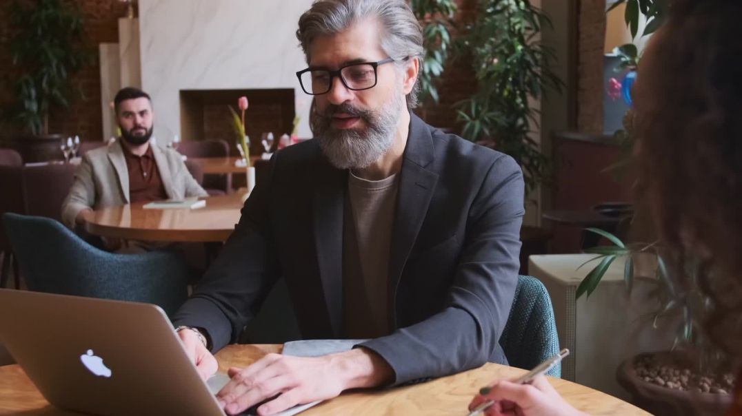 ⁣Focused Professional Man Working on Laptop Free Download